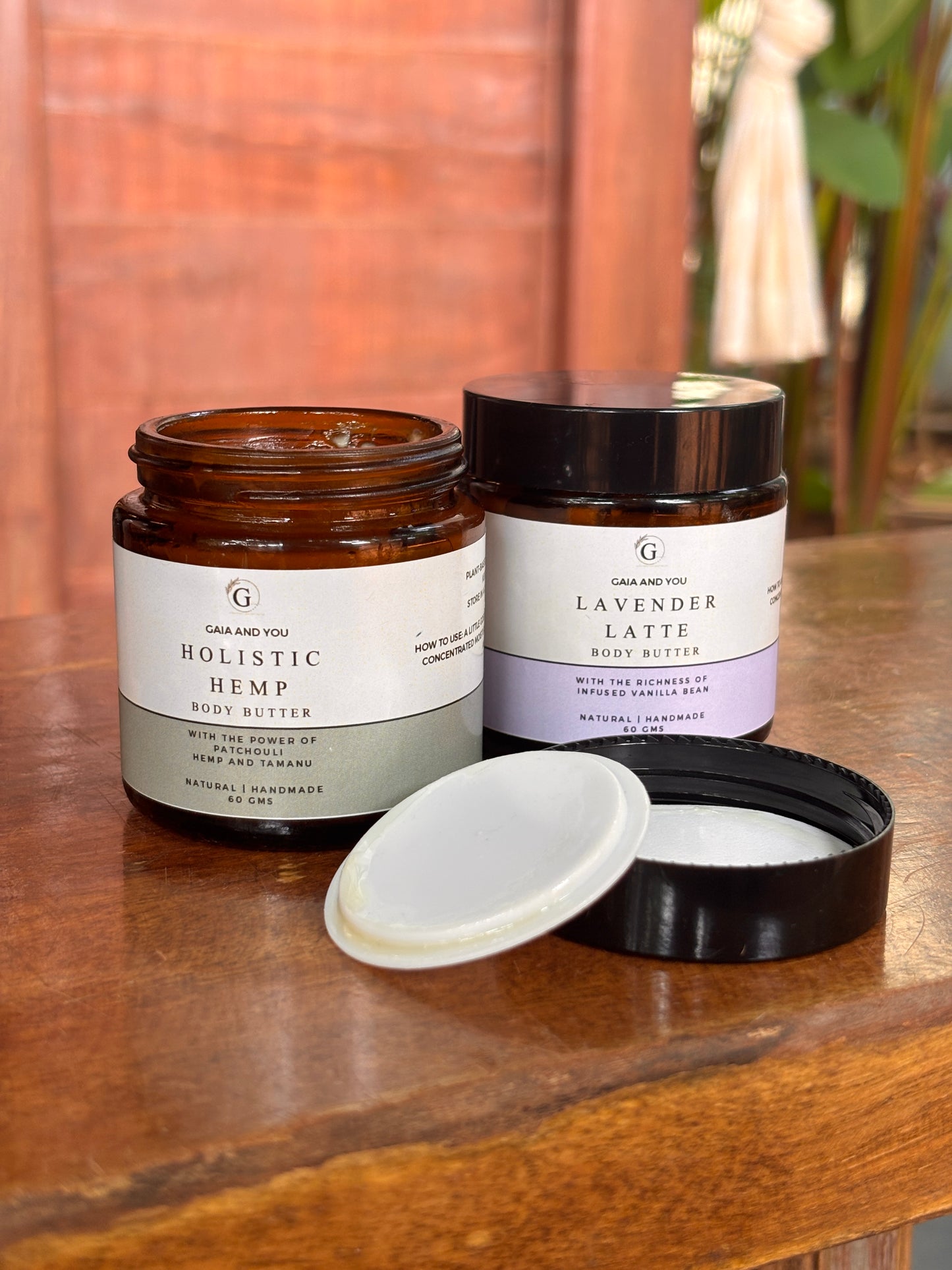 Image of a bottle of Holistic Hemp body butter made with hemp, patchouli, and tamanu with shea butter, mango butter, and kokum butter.