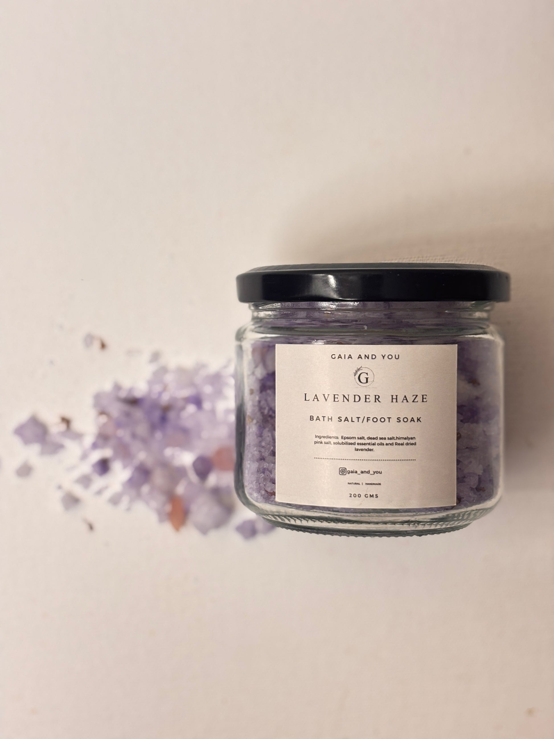 One jar of Lavender Haze Bath Salt with visible purple bath salts scattered on the side.
