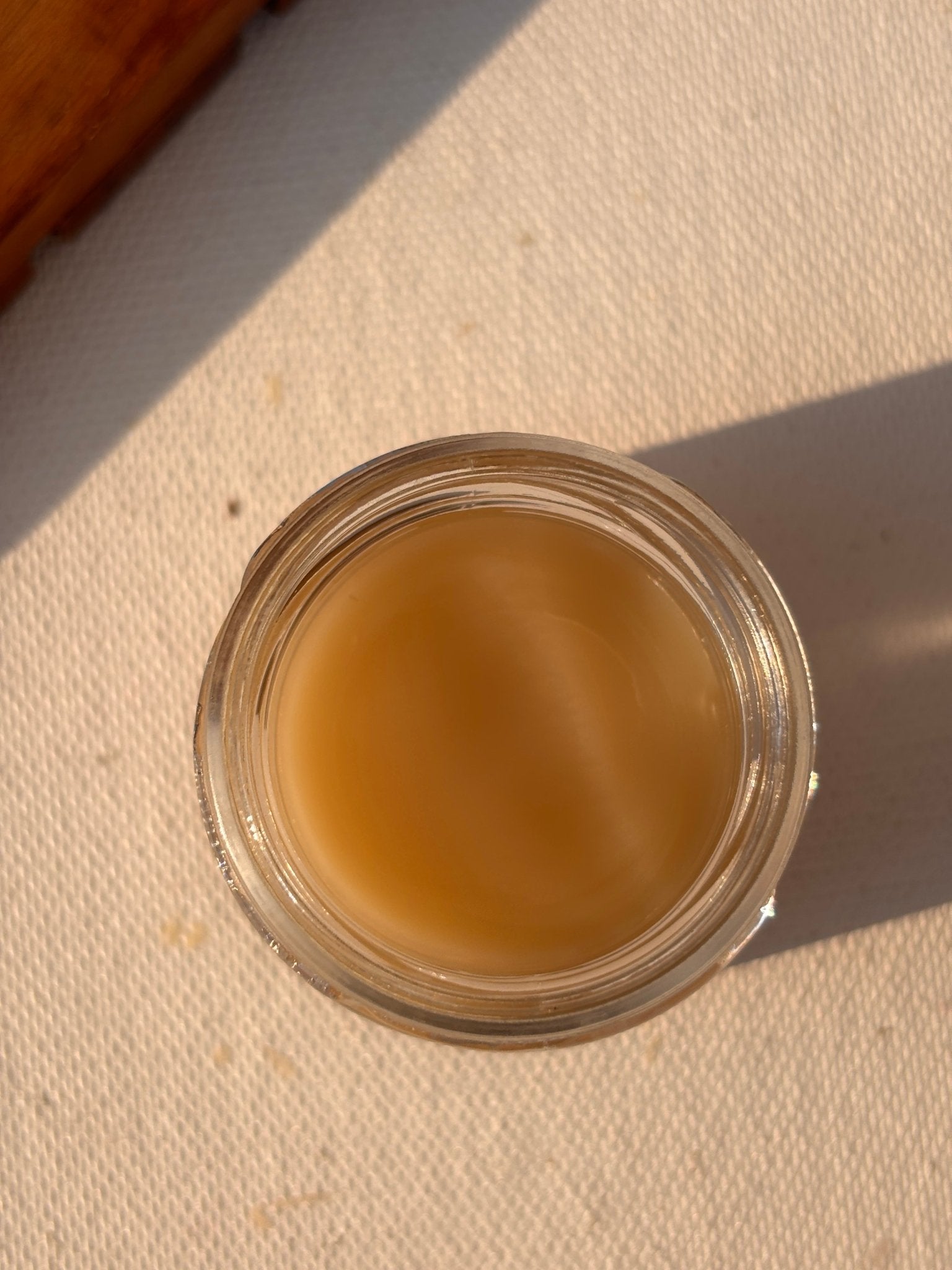 Open jar showing 'Fleur' lip butter